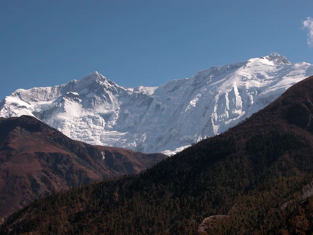 Annapurna 12 09 Annapurna II and Annapurna IV From Braga From Braga, the north face of Annapurna II (7937m) leads across a long ridge to Annapurna IV (7525m). Annapurna IV was first climbed on May 30, 1955 via the North Face and Northwest Ridge by Heinz Steinmetz, Harald Biller, and J�rgen Wellenkamp.